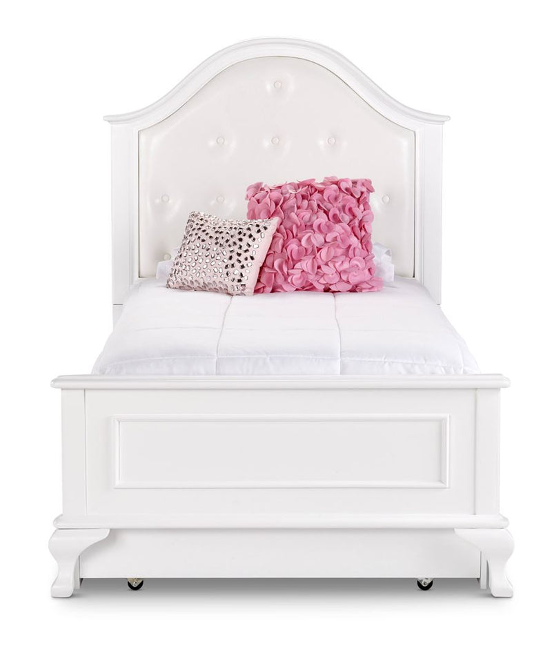 White twin bed with upholstered headboard and trundle