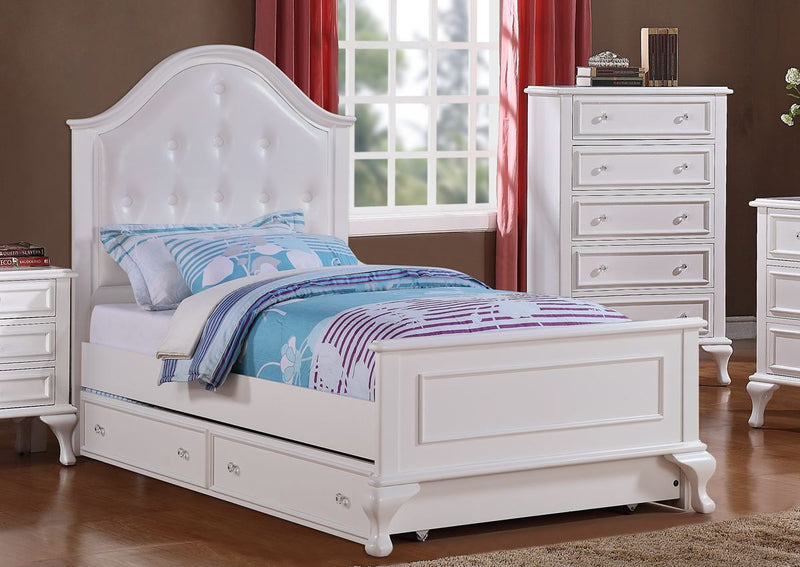 White twin bed with upholstered headboard and trundle